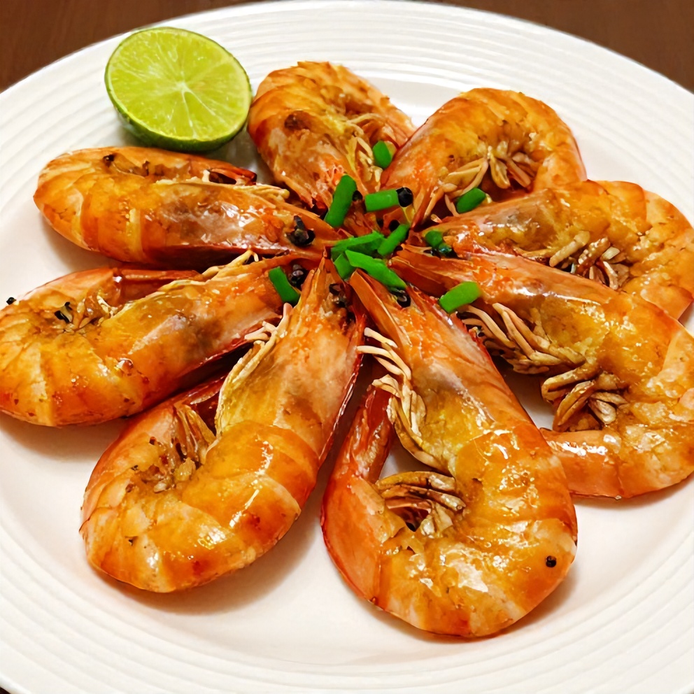 Honey garlic shrimp plated with green onions